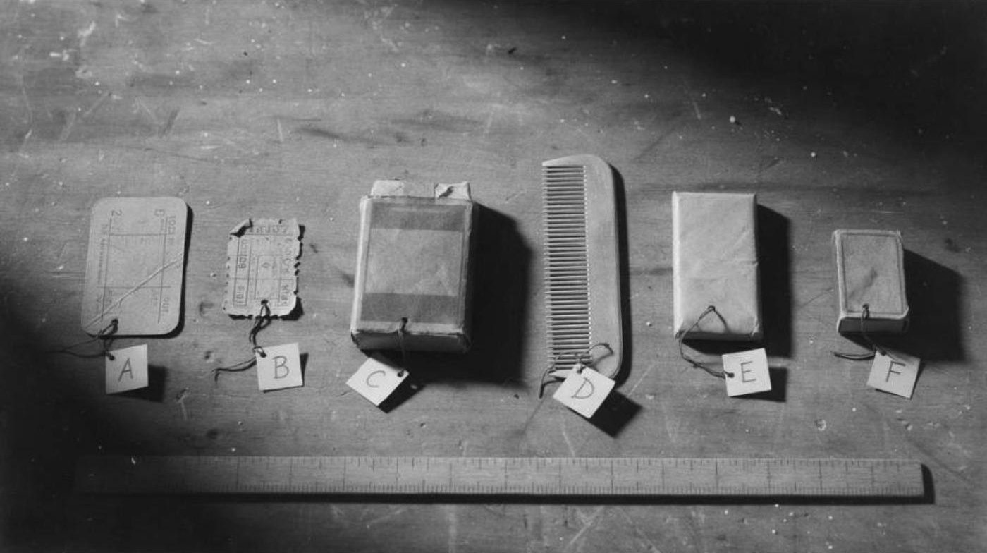 Reconstruction: items from the man's pockets laid out with evidence tags